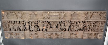 An antique Indian carved and pierced hardwood narrative panel with various Indian gods and animals