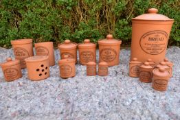 An extensive set of lidded terracotta kitchen jars, The Original Suffolk Canister by Henry