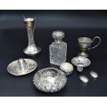 A collection of silver to include an English hallmarked silver waisted vase and a pierced dish as