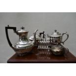 Five items of silver plated ware; a coffee pot, two teapots, a milk jug and a toast rack. H.32cm