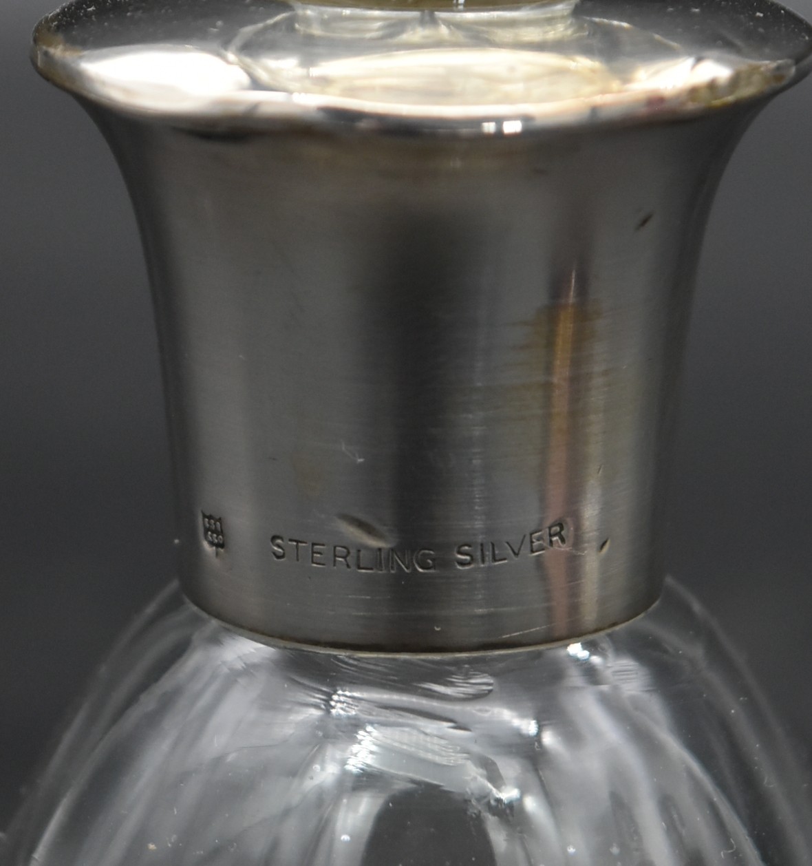 A cut cranberry glass bottle and stopper in a silver pierced stand hallmarked Birmingham 1923 - Image 3 of 6