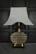 A heavy brass Chinese style table lamp base with white flared shade. H.72cm W.30cm