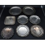 A set of four silver plated trays, two similar trays with gadrooned edges and two engraved trays.