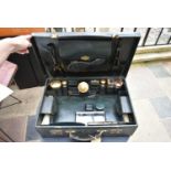 An early 20th century leather travelling gentleman's dressing case, well fitted with a wide