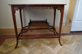 An Edwardian mahogany occasional table with central satinwood urn inlaid medallion on swept supports