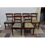 A set of six Regency beech framed faux rosewood painted dining chairs with profusely inlaid bar