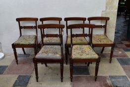 A set of six Regency beech framed faux rosewood painted dining chairs with profusely inlaid bar