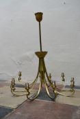 A large ten branch gilt metal ceiling chandelier with scrolling arms. H.117cm