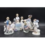A collection of five Lladro figure groups, children in various activities. H.23cm