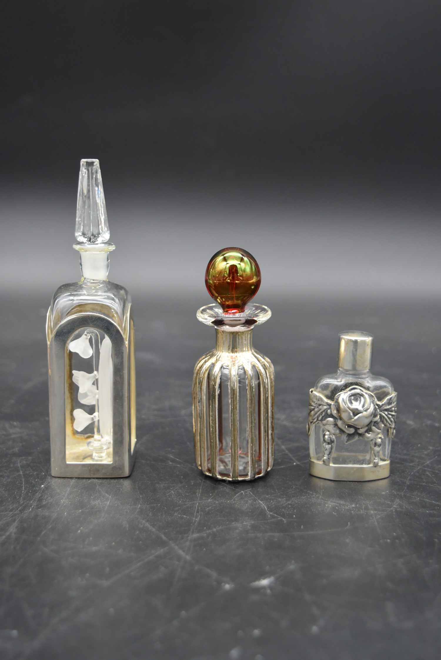 A collection of eight glass perfume bottles, hand painted and silver mounted, various hallmarks, H. - Image 6 of 14