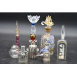 A collection of eight glass perfume bottles, hand painted and silver mounted, various hallmarks, H.