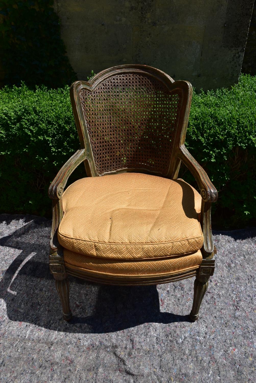 A Continental style painted and caned back armchair with fitted squab cushion raised on shaped - Image 2 of 6