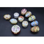 A collection of six gilt metal and porcelain hand decorated Limoges pill boxes along with five