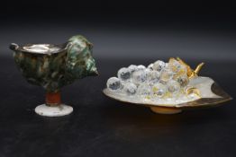 A collection of crystal and sea shells with a collection of Swarovski crystal pieces, including a