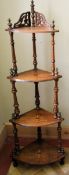 A Victorian burr walnut and satinwood floral inlaid four tier corner whatnot on turned supports. H.
