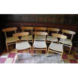 Hans Wegner for Carl Hansen & Son, a set of eight teak dining chairs model CH23 on restrung corded