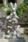 Ross Bonfanti, concrete and mixed material sculpture, a pyramid of bunny rabbits, comes in four