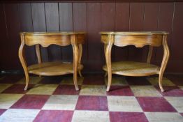 A pair of French style walnut quarter veneered and crossbanded side tables with plate glass tops