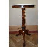 A 19th century mahogany marble topped lamp table on ring turned pedestal base with tripod cabriole