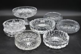 A miscellaneous collection of eight large cut crystal dishes and ashtrays. H.13cm W.21cm