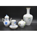 A hand gilded and painted porcelain coffee set by Herend to include coffee pot and a pair of