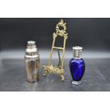 A silver plated cocktail shaker by Christofle, maker's mark to underside, a blue crystal Lampe