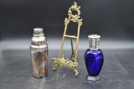 A silver plated cocktail shaker by Christofle, maker's mark to underside, a blue crystal Lampe