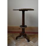 A 19th century amboyna and ebony occasional table with ormolu bound and geometric marquetry inlaid