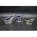 Three silver sugar baskets, with blue glass liners. TH for Thomas Hayes, Birmingham 1878. Walker and