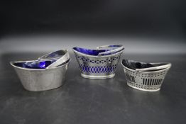 Three silver sugar baskets, with blue glass liners. TH for Thomas Hayes, Birmingham 1878. Walker and