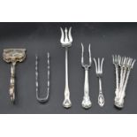 A miscellaneous collection of 19th century and later English silver flatware to include asparagus