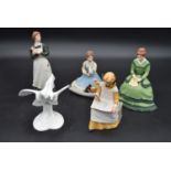 Four franklin porcelain figures from the Little Women series and a Royal Doulton figure group,