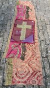 Two silk and gilt threaded textile fragments along with a framed and glazed gilt thread crucifix.