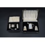 A cased silver cruet, mustard pot and spoon and salt and pepper shakers, CBrs for Clifford Brothers,