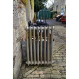 An ornate Victorian cast iron radiator. H.89 W.65cm (one foot missing).