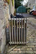 An ornate Victorian cast iron radiator. H.89 W.65cm (one foot missing).