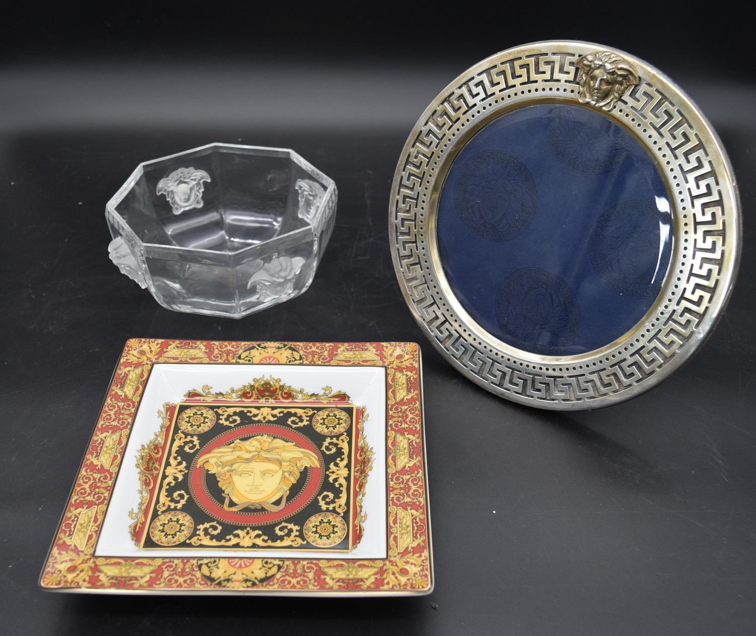 A Versace silver plated picture frame, octagonal glass bowl and a pin dish each with the Versace