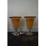 A pair of contemporary opaque amber and blue glass table uplighters. H.46cm