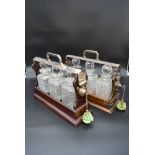 A 19th century silver plated and mahogany cased three bottle locking tantalus and a similar faux