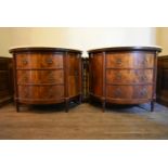 A pair of early 20th century French Empire style figured mahogany demi lune side cabinets with