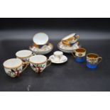 A set of four Garrrard blue and gilt Chinese influenced cups and saucers, three Japanese cups, a