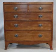 A Regency mahogany chest of drawers with satinwood and ebony stringing and original handles on swept