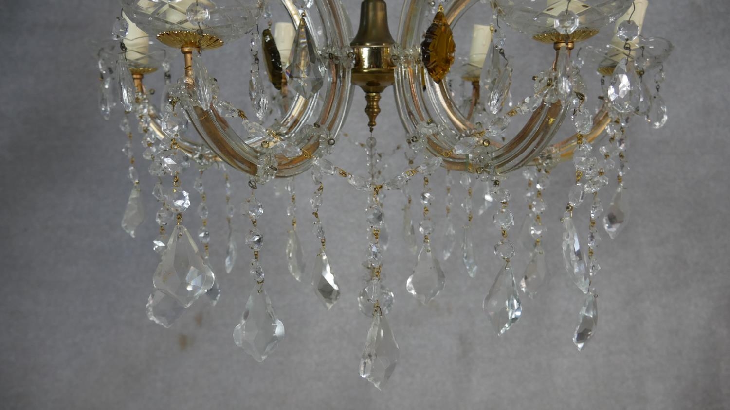 A vintage gilt metal and glass six branch chandelier with crystal drops and swags. W.60cm - Image 4 of 6