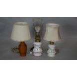 A vintage basket weave design table lamp and two others in the style of Victorian milk glass oil