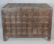 An Eastern hardwood metal bound and panelled coffer on block supports. H.87 W.122 D.82cm