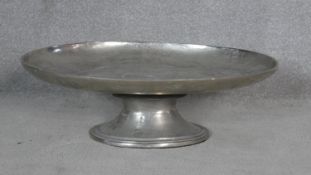 A large contemporary pewter oval pedestal serving/display platter. H.21 L.65.5 W.47cm
