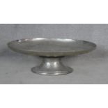A large contemporary pewter oval pedestal serving/display platter. H.21 L.65.5 W.47cm