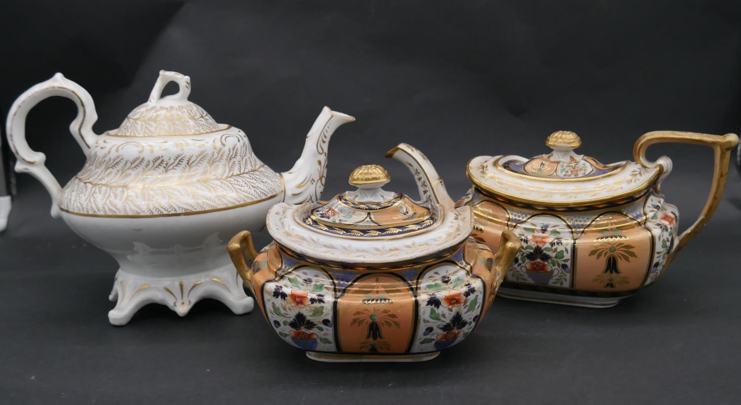 A collection of hand painted and gilded porcelain. Including a white porcelain tea pot with gilded