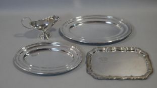 Three silver plated serving trays and a WMF gravy boat with scrolling handle and maker's stamp to