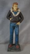 A painted life size figure of James Dean in fibreglass with copyright mark to the base. H.183cm